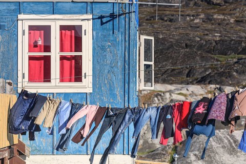 Laundry drying in the wind in front of the house, Inuit settlement, Ittoqqortoormiit, East