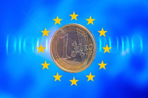 Symbolic image of the digital euro: one-euro coin against a virtual background