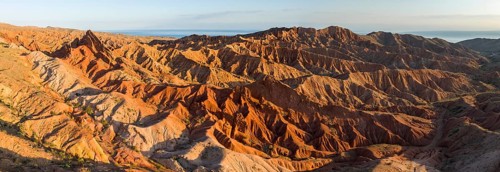 Aerial view, eroded mountain landscape, sandstone cliffs, canyon with red and orange rock
