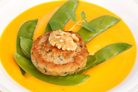Vegetarian cuisine, walnut cakes on sugar snap peas with pumpkin sauce, sauce, vegetables, snow