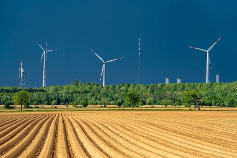 Wind turbines on the Grevenbroich wind test field, dark rain clouds, in the Rhenish lignite mining