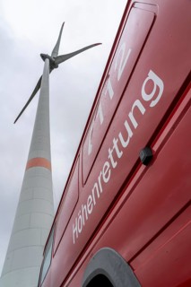 Height rescuers from the Oberhausen fire brigade practise abseiling from a wind turbine from a