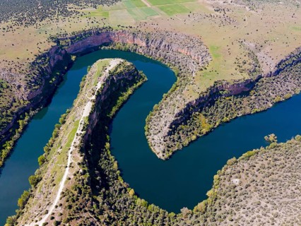 Panoramic view of a river running through dramatic gorges and dense vegetation, aerial view, gorge,
