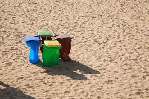 Rubbish bins on the sandy beach