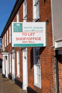 Estate agent commercial property To Let Shop Office sign, Wickham Market, Suffolk, England, UK