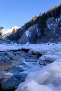 Inn or En near Scuol in winter, with ice floes, Engadin, Grisons, Switzerland, Europe