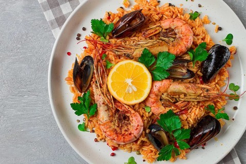 Seafood paella, shrimp and mussels risotto, rice, homemade, top view, no people