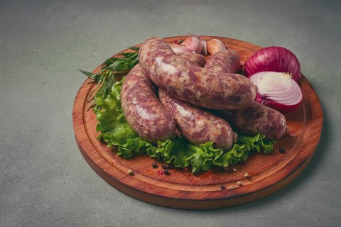 Raw kupaty, traditional Georgian sausages, raw sausages, with spices and herbs, Georgian cuisine