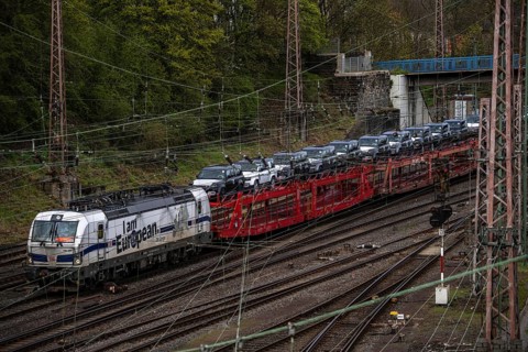 Freight train, car train with Landrover new cars on the goods train line at the Hagen-Vorhalle