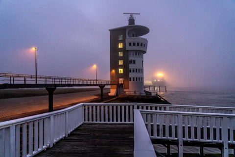 Thick fog in winter, hanging over the mouth of the Elbe into the North Sea, radar tower of the