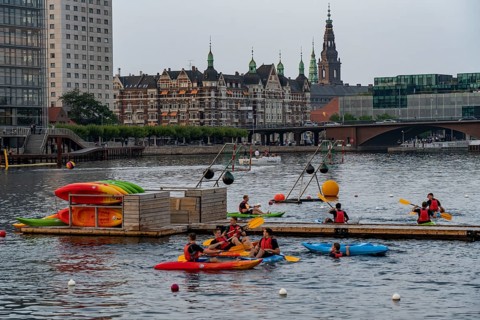 Summer evening in Copenhagen, at the harbour, Islands Brygge, people celebrating, eating, drinking,