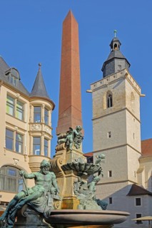 Old Anger Fountain built in 1890 with sculptures, historic building and Gothic Wigberti Church,