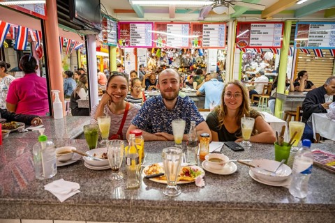 Tourists sitting at a table at a food stall, Mercado Central de San José, San José, Costa Rica,