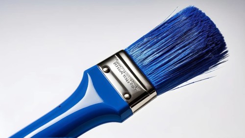 Thick paintbrush dipped in blue bristles dripping onto a white background, AI generated