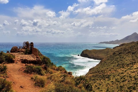 Mirador de La Amatista with view of rocky coast, coastline at La Isleta, sunny weather, typical