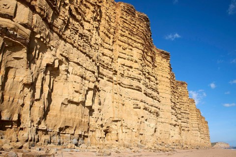 Sandstone cliffs and beach West Bay, Bridport, Dorset, England, UK