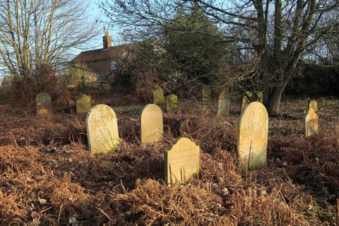 Old overgrown gravestones former Baptist church graveyard, Sutton, Suffolk, England, UK