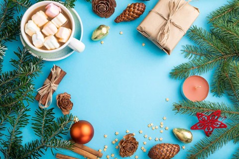 Christmas or New Year frame composition. Decorations, box, cinnamon, cones, fir and spruce