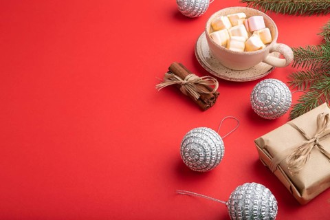 Christmas or New Year composition. Decorations, box, cinnamon, silver balls, fir and spruce