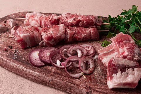 Raw pork meat, on wooden sticks, pickled kebab, with spices, top view, no people