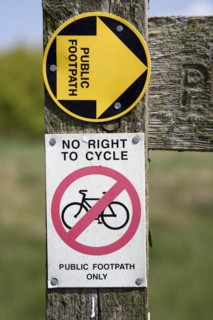 Public footpath sign no right to cycle sign close up, Suffolk, England, UK