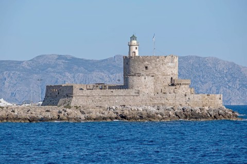 Agios Nikolaos fortress with lighthouse, Mandraki harbour, Rhodes town, Rhodes, Greece, Europe