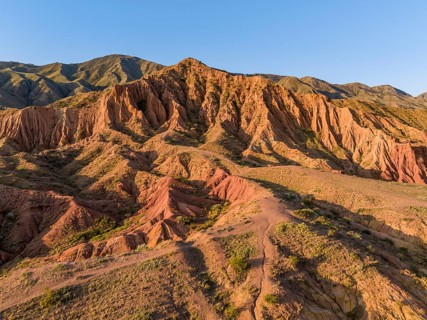 Aerial view, eroded mountain landscape, sandstone cliffs, canyon with red and orange rock
