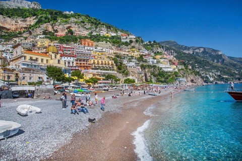 Beach with panoramic view of the village on the cliffs above the sea, Positano, Amalfi Coast,