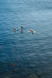 People on paddleboards, White Cliffs. Old Harry Rocks Jurassic Coast, Dorset Coast, Poole, England,