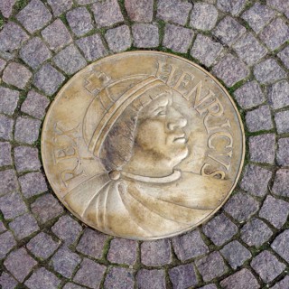 Medallion of the first King of Germany Henry the Fowler embedded in cobbled street, Meissen,