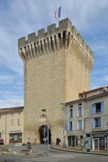 Porte d'Orange, city gate with battlements and French national flag, defence defence tower,