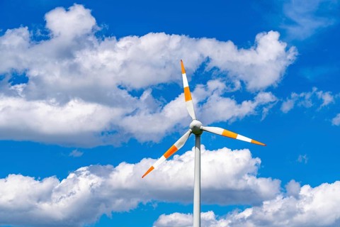Wind turbine, wind energy plant from the manufacturer Enercon, blue sky with many white clouds,