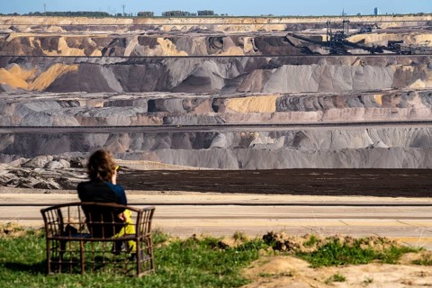 Edge of the Garzweiler II open-cast lignite mine, the last buildings of the abandoned village are