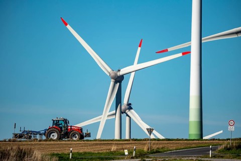 Wind farm near Lichtenau, wind turbines, country road, Driburger Straße, tractor at work in the