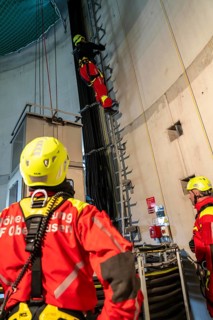 Height rescuers from the Oberhausen professional fire brigade practise abseiling from a wind