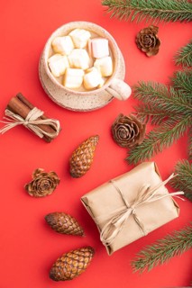 Christmas or New Year composition. Decorations, box, cinnamon, cones, fir and spruce branches, cup
