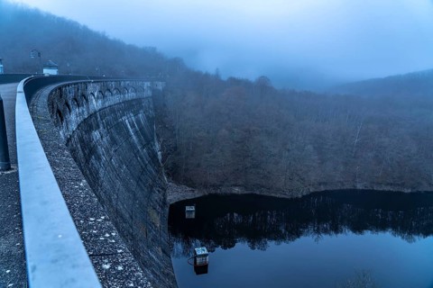 The dam wall of the Urft dam, in the Eifel, reservoir, in winter, fog, near Schleiden, North