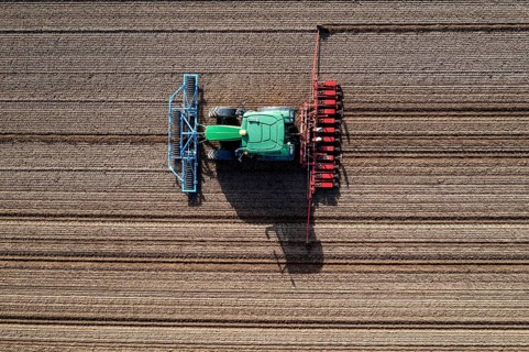 Sugar beet being sown in spring, precision sowing with precision seed drill, behind a tractor,