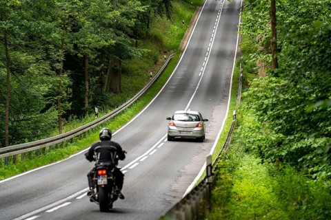 Country road through a forest, near Hofgeismar, in Hesse, Germany, Europe