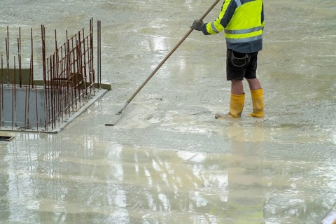 Construction site, concreting, the floor slab of a building is concreted, the fresh concrete is