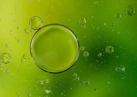 Colorful abstract macro background with oil drops in water