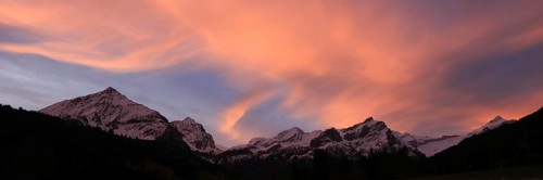Colorful morning sky over a mountain range in Gsteig Bei Gstaad