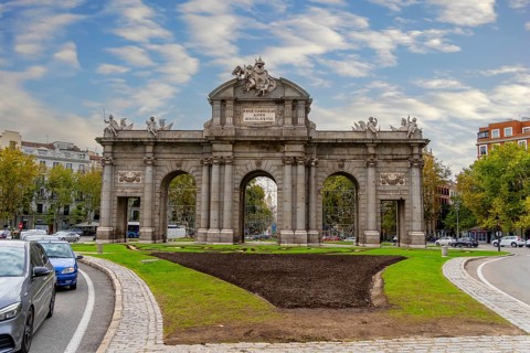 The Puerta de Alcalá is a Neo-classical gate in the Plaza de la Independencia in Madrid, Spain,