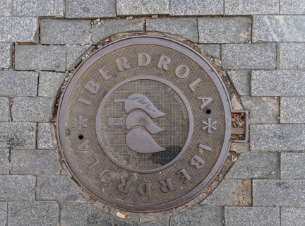Madrid manhole cover on a busy street in Madrid, Spain, Europe
