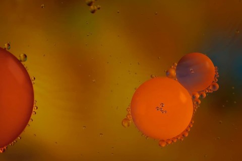 Colorful abstract macro background with oil drops in water