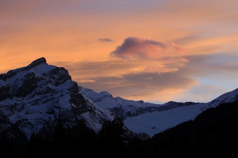 Bright orange clouds over Mount Oldehore, Switzerland, Europe