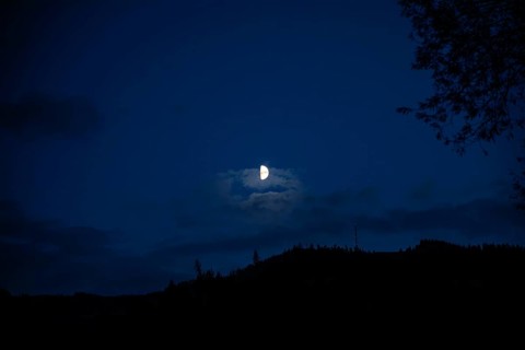 Moon over a range of hills, Mugel mountain, Leoben, Styria, Austria, Europe