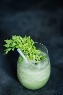 Healthy green vegetables juice glass with kale and celery