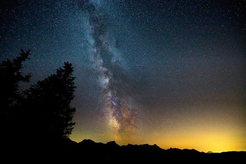 Starry Milky Way above a mountain panorama at dusk, Gantrisch Star Park, Bernese Oberland, Canton