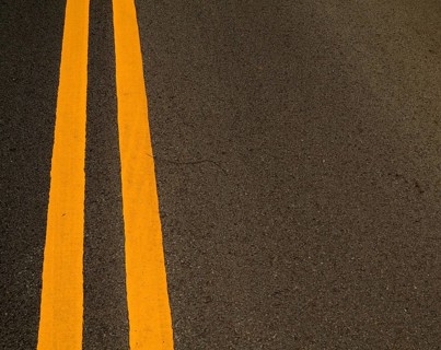 Double Yellow Marking Lines On A Road With Copy Space